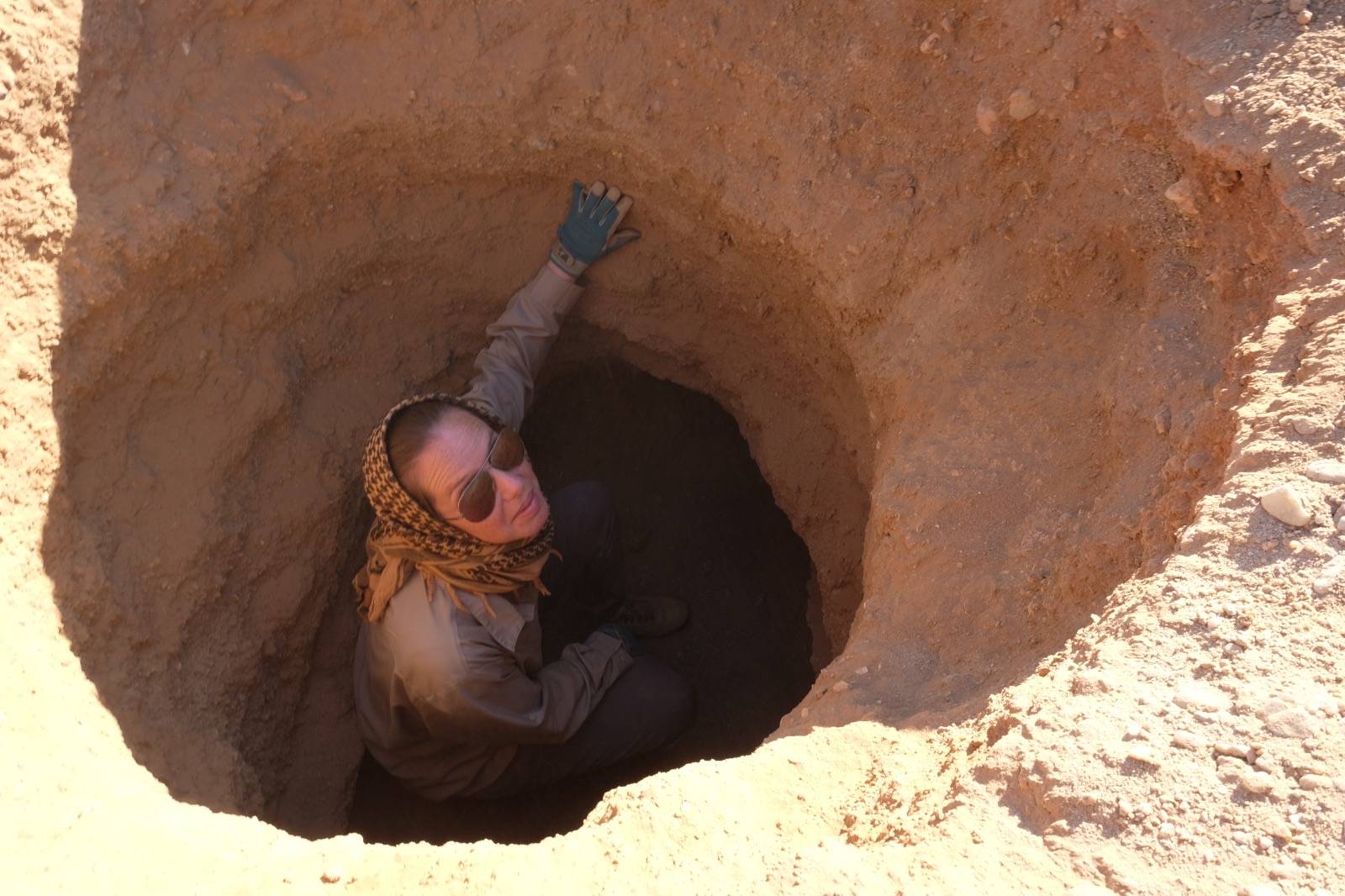 Dr. Kari Guilbault at the entrance of a cave